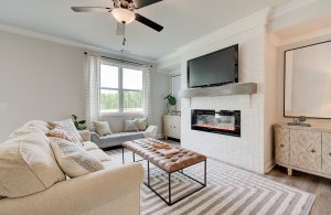 great room painted brick, model home fireplace