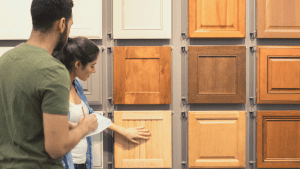 man and woman shopping for wood cabinets