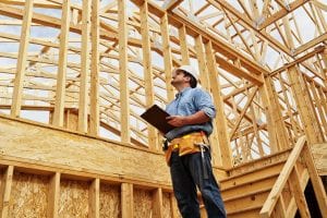 Construction Worker on Site with Clipboard