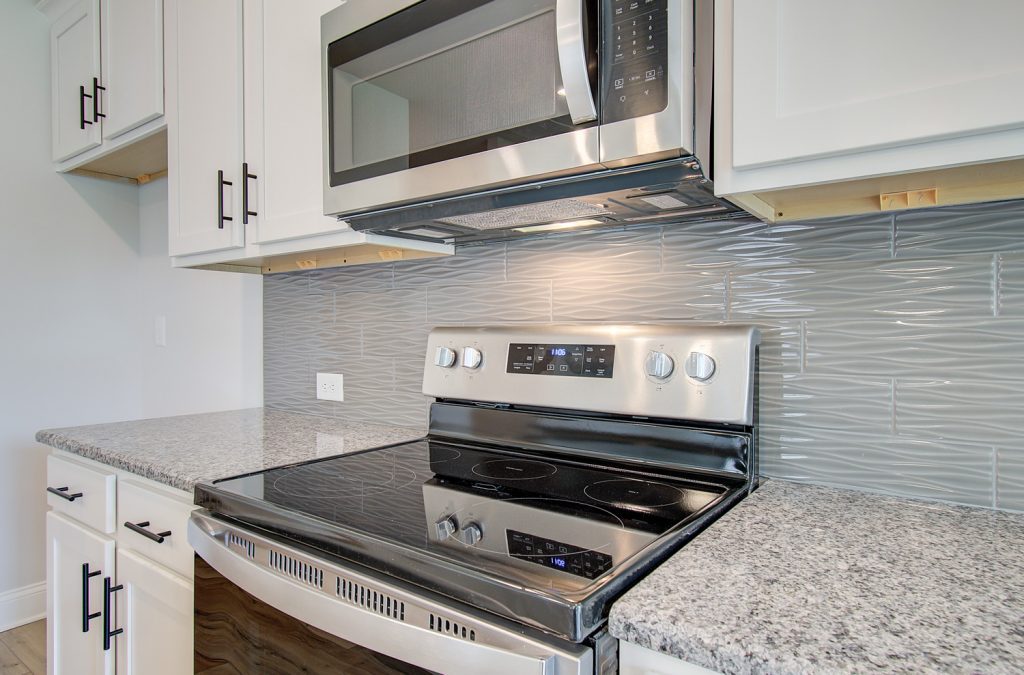 backsplash and stove and microwave