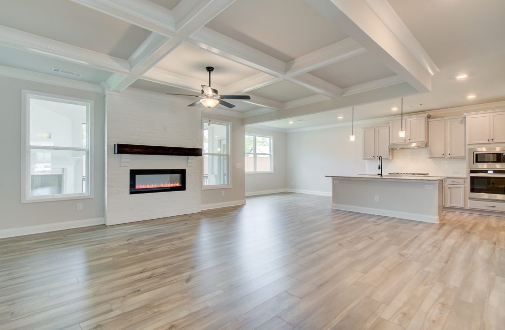 great room open concept living with coffered celings
