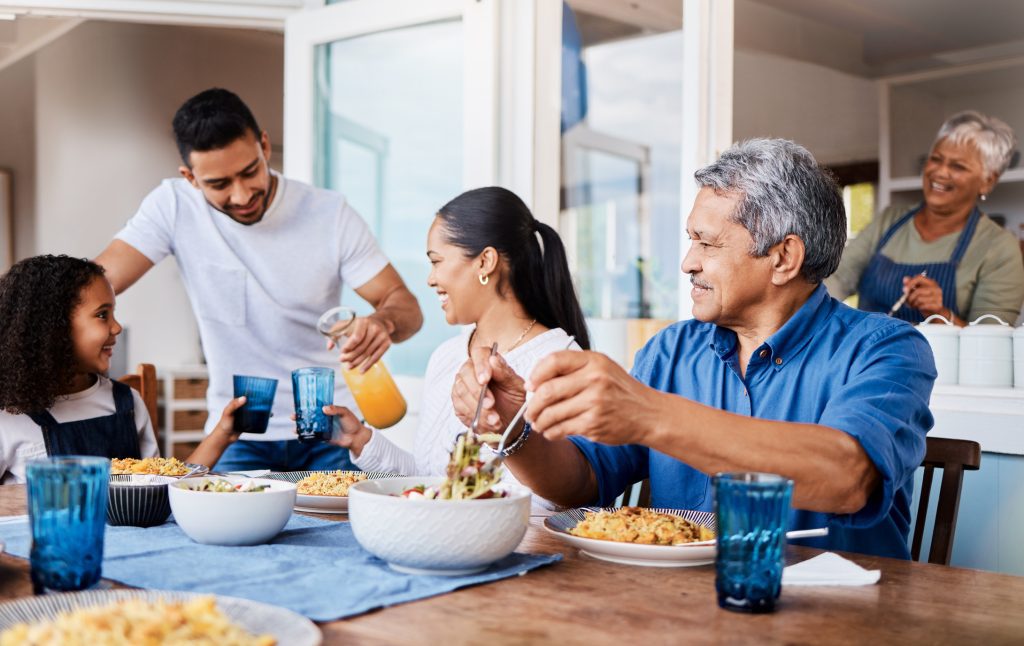 multigenerational home family at kitchen table eating